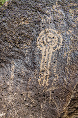 Petroglyph on volcanic rock in national monument park in Albuquerque, New Mexico