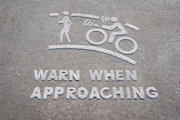 bicycle warning when drive approaching on the walk road