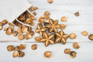Fototapeta na wymiar Sacha inchi peanut seed on table. To eat as medicine or processed into products.