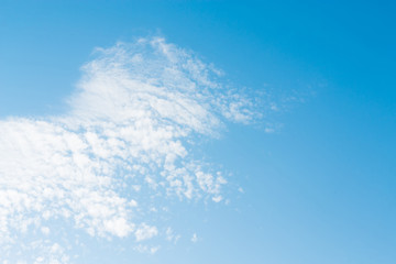 Blue sky with clouds background lines intersect.