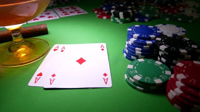 Double Aces With Poker Chips. Winner In Poker. Royal Flush. Cigar and Glass with Brandy On The Table With Poker Chips
