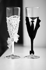 Two decorated champagne glasses for a wedding party