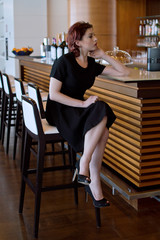 Girl sitting in a lounge bar