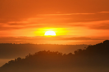 Big sun and Mist in sunrise,Sun on Sunrise,sun and mist on mountian,Morning,Sun on during sunrise,White balace orange on sunrise