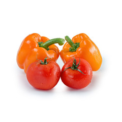 Two orange pepper and two tomato on isolated background