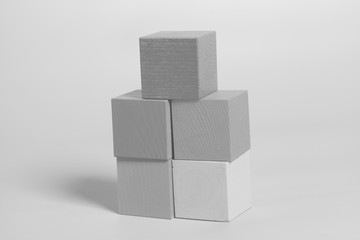 Wooden cubes on gray background