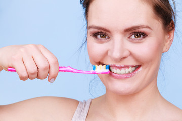 Woman brushing cleaning teeth