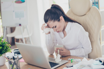 Flu at work. Tired sick business lady lawyer with strong migraine grimace. She is wearing the formalwear, sitting at the office, touching her forehead