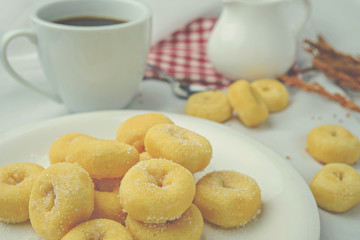 Sweet donuts and coffee on table white background.
