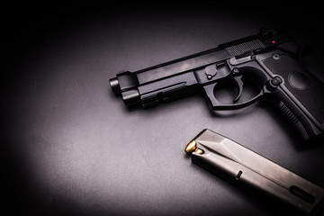  9mm pistol gun on black background