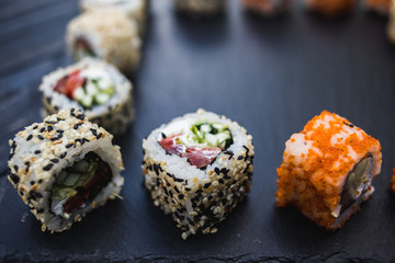 Japanese sushi on a rustic dark background