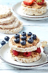 Rice cake with peanut butter and berries