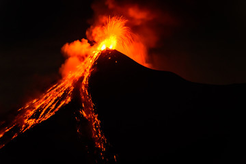 Lava spurts from erupting Fuego volcano in Guatemala