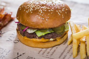 Fresh appetizing burgers with potatoes