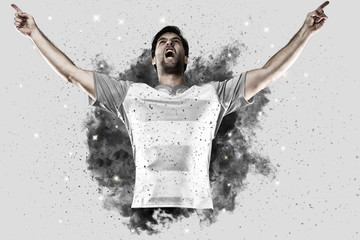 Rugby player coming out of a blast of smoke.