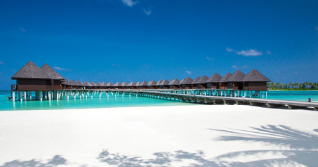 Fototapeta na wymiar beach with water bungalows at Maldives