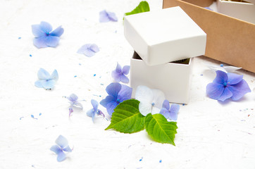 Small white gift box with hydrangea flowers
