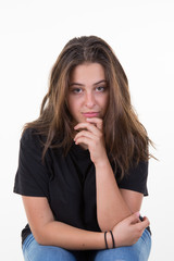 Portrait of a pretty young woman standing against white background