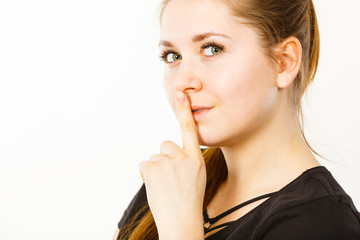 Naklejka premium Woman showing silence gesture with finger