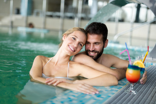 Picture of happy couple relaxing in pool