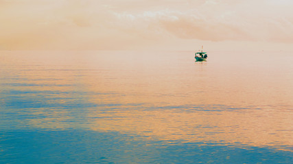 One boat stop distant from the beach in morning : seascape