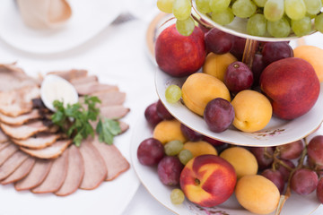 Served table in restaurant or cafe, salads, fruits and vegetables