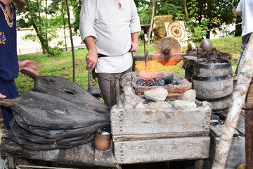 Blacksmith when working with a hammer in the open air