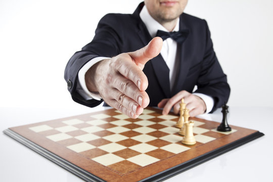 Handshake. Win or lose startegy. Chess game
