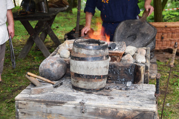 Blacksmith when working with a hammer in the open air