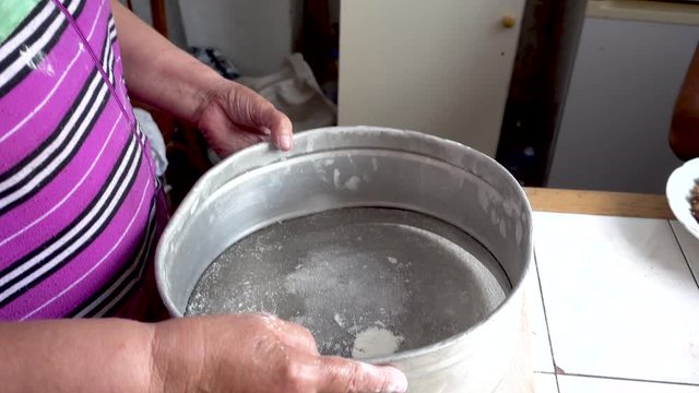 Sifting the Flour Through a Sieve. Realtime video