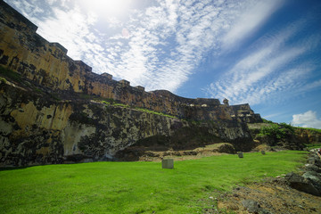 Fototapeta na wymiar Protection wall of historic Puerto Rico city with beautiful clouds