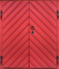 Old big red door with a lock