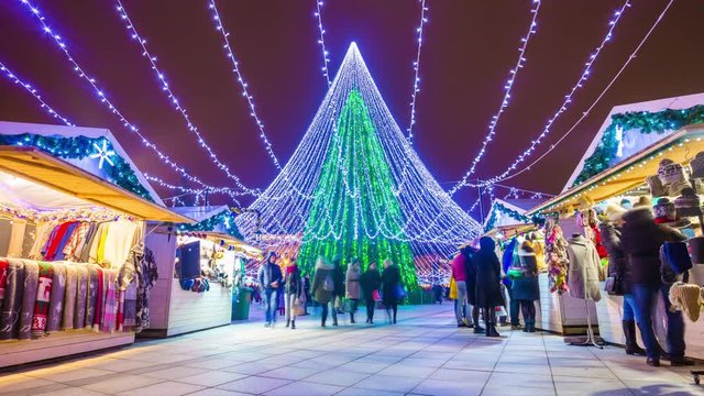 vilnius famous christmas holiday tree illuminated crowded market panorama 4k time lapse lithuania 
