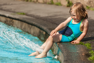 Little girl in a public pool for kids