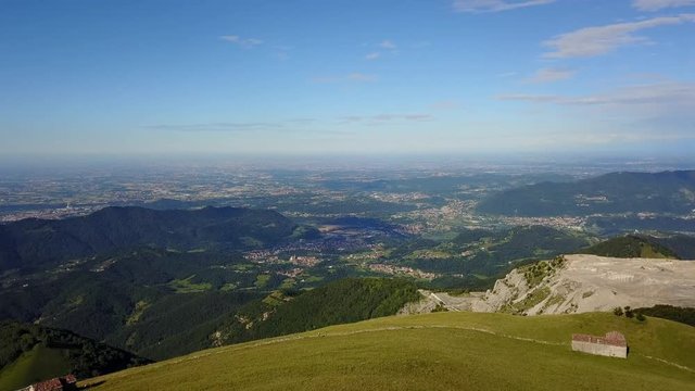 Superb 360&deg; landscape on the Padana plain and Alps in summer time. Panorama from Linzone Mountain, Bergamo, Italy. 