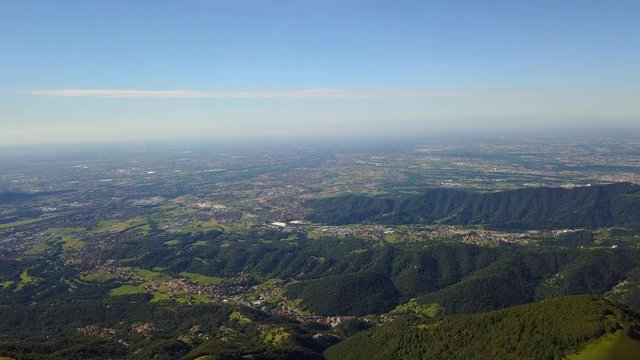 Superb 360&deg; landscape on the Padana plain and Alps in summer time. Panorama from Linzone Mountain, Bergamo, Italy