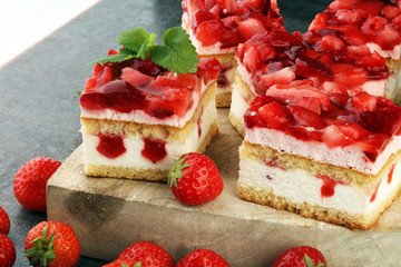 strawberry cake and many fresh strawberries on grey background
