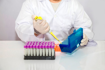 Lab scientist is preparing specimen for his experiment test in lab area
