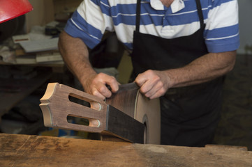 Man working at a Workshop with Musical instruments