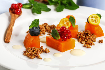 dessert. Buckthorn jelly and crumble oatmeal on a white plate for the restaurant menu