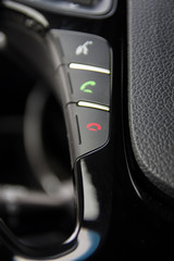 Obraz premium Phone, hands free console on vehicle's steering wheel