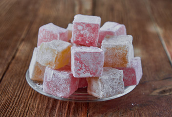 Delicious turkish delight on a wooden background