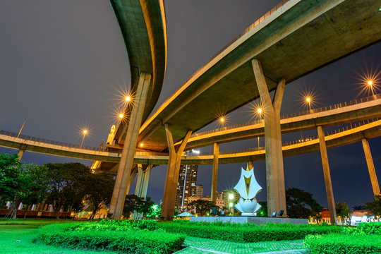 Fototapeta Under the bridge and lighting in night time / Public park at under expressway in night time