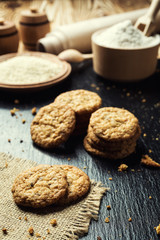 Biscuit sweet cookie background. Domestic stacked butter biscuit pattern concept,close up macro.Homemade cookies on wooden table.Cereal biscuits with the sesame,peanuts,sunflower and amaranth.