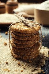 Biscuit sweet cookie background. Domestic stacked butter biscuit pattern concept,close up macro.Homemade cookies on wooden table.Cereal biscuits with the sesame,peanuts,sunflower and amaranth.