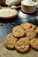 Biscuit sweet cookie background. Domestic stacked butter biscuit pattern concept,close up macro.Homemade cookies on wooden table.Cereal biscuits with the sesame,peanuts,sunflower and amaranth.