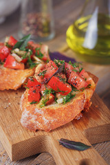 Bruschetta with chopped tomatoes, basil and herbs on grilled crusty bread.
