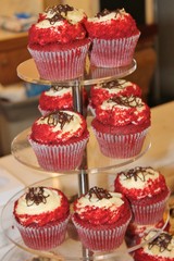 red velvet cupcakes on stand on kitchen counter
