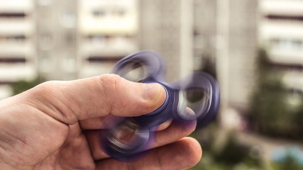 The hand holds the spinner