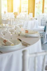 table setting with spoon, knife, plates and glass